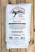 A white bag of Vermont Compost Company Fort Vee All Purpose Compost Based Potting Mix, displayed flat on a rustic wooden plank background.