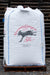 A large white bulk bag of Vermont Compost Company Soil, printed with a black donkey logo and red text, sitting on a wooden pallet in front of stacked pallets.