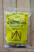A packaged wedge loc fence brace in a clear plastic bag with a bright yellow label, displayed on a wooden surface.