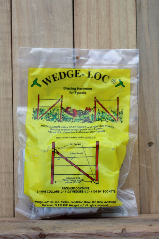 A clear plastic bag containing Wedge-Loc wedge bracing hardware for tposts, with a bright yellow printed insert showing diagrams and product details, photographed against a light wood plank background.