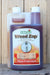 A bottle of SaferGro Weed Zap herbicide with a white cap and a clear side container, set against a rustic wooden plank background.